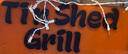Tin Shed Grill logo